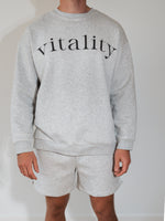 A man wearing the Vitality Cozy Uni Short in Stone Marl