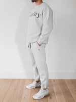 A man wearing the Vitality Cozy Uni Jogger in Stone Marl