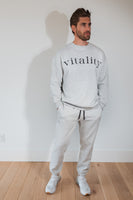 A man wearing the Vitality Cozy Uni Crew in Stone Marl