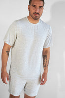 A man wearing the Vitality Float Uni Basic Tee - Stone Marl