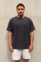 A man wearing the Vitality Retro Uni Tee - Iron Washed