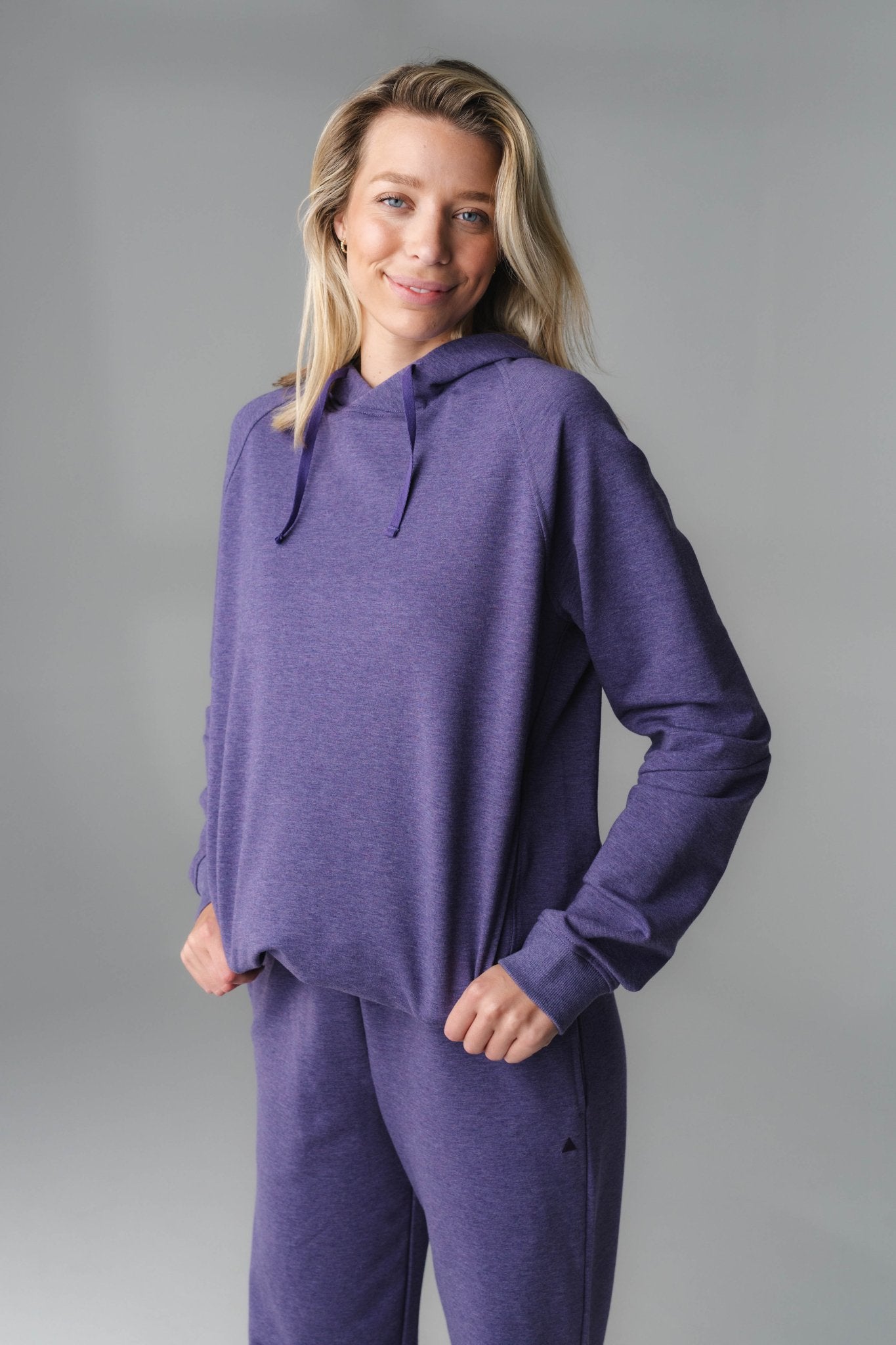 A woman wearing Violet Marl Studio Hoodie