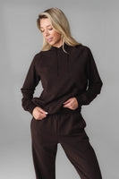 A woman wearing Espresso Marl Studio Hoodie