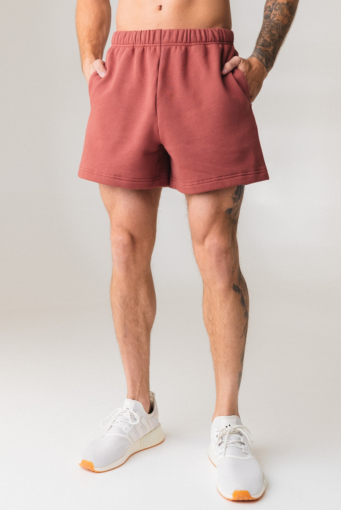 A man wearing the Vitality Uni Cozy Short in Rosewood