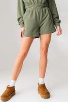 A woman wearing the Vitality Uni Cozy Short in Willow