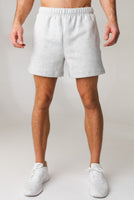 A man wearing the Vitality Uni Cozy Short - Stone Marl