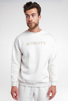 A man wearing the Uni Cozy Crew in Oat Marl