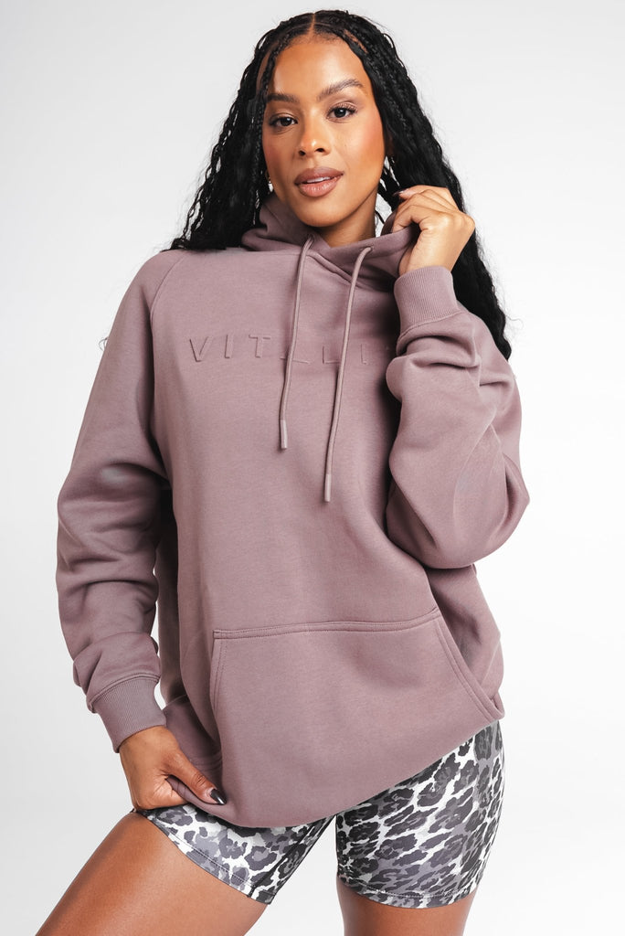 A woman wearing Vitality's Maker Hood in Mocha