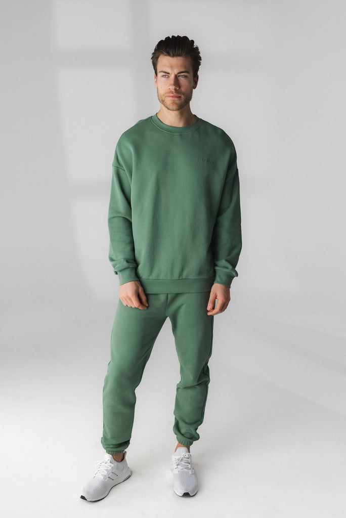 A man wearing Cozy Jogger - Serpentine, Gender Neutral Jogger from Vitality Athletic and Athleisure Wear
