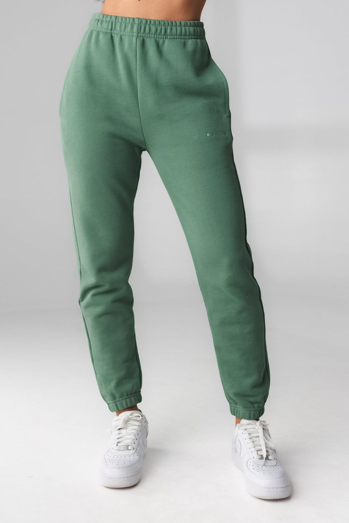 A woman wearing Cozy Jogger - Serpentine, Gender Neutral Jogger from Vitality Athletic and Athleisure Wear