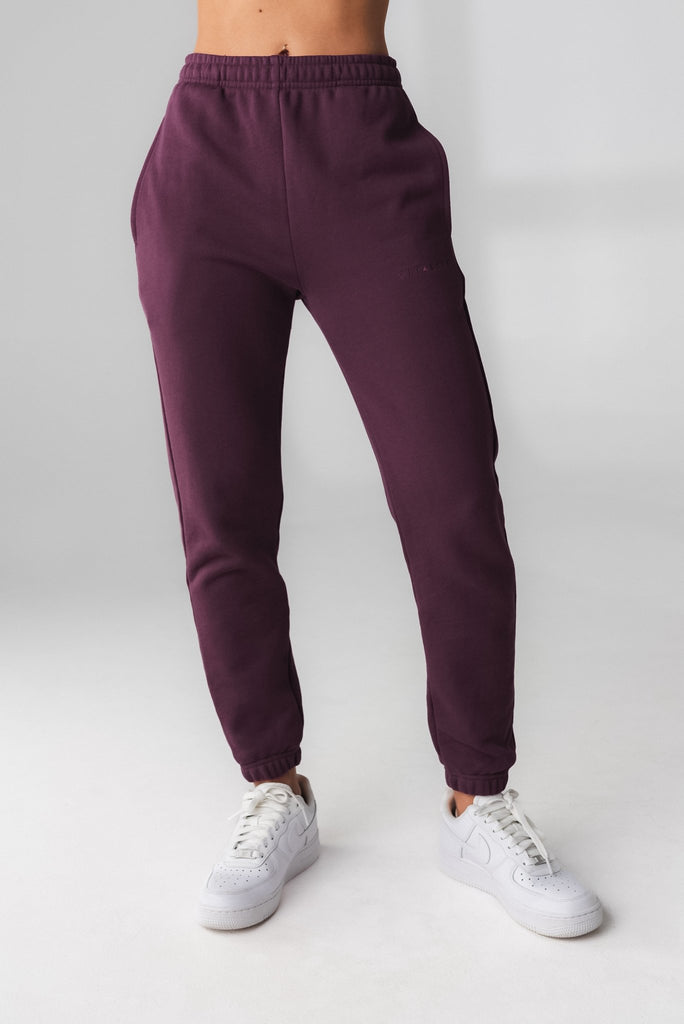 A woman wearing Cozy Jogger - Wine, Gender Neutral Jogger from Vitality Athletic and Athleisure Wear