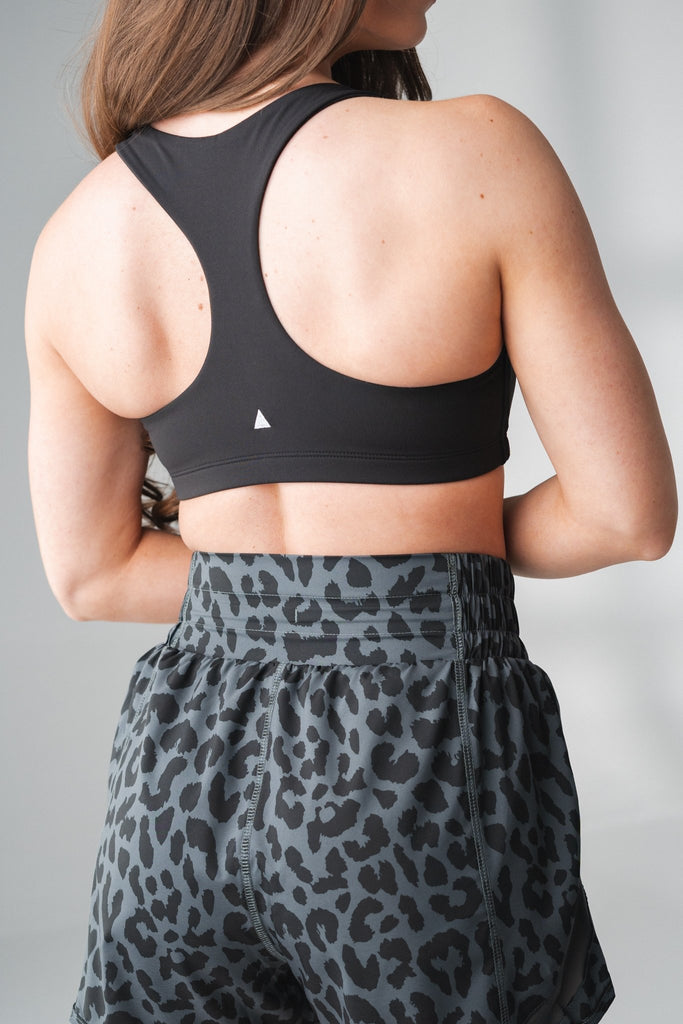 Shape your Summer in our Compress & Compact Sports Bra - bold in